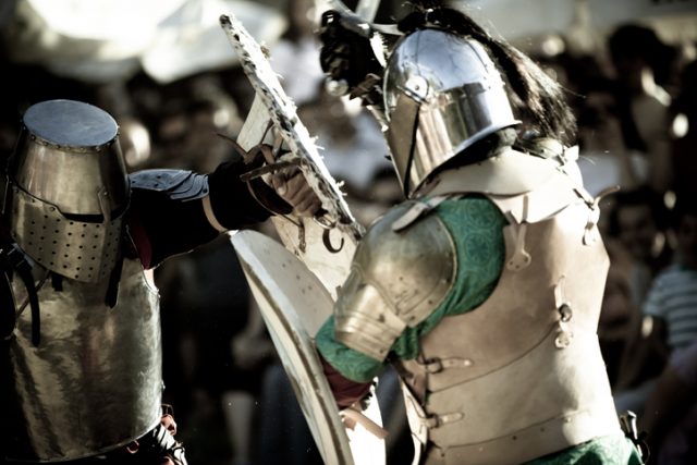 Two knights do mock battle at a medieval fair in Southern Spain