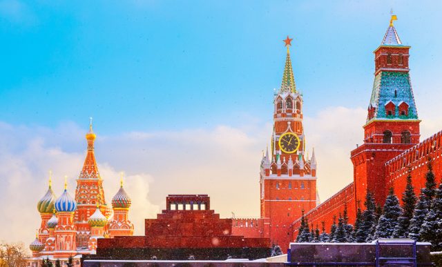 Kremlin wall Spasskaya Tower and Lenin’s Mausoleum, Red Square, Moscow.