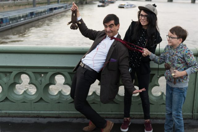 An Impersonator dressed up like Mr. Bean entertaining tourists for tips