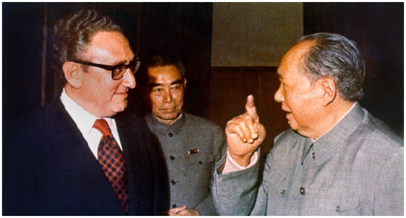 Henry Kissinger, shown here with Zhou Enlai and Mao Zedong, negotiated rapprochement with the People's Republic of China.