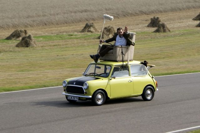 Rowan Atkinson re-enacting a famous scene from the episode Do-It-Yourself Mr. Bean on a Mini at Goodwood Circuit Revival, 2009. Photo by Nathan Wong CC BY 2.0