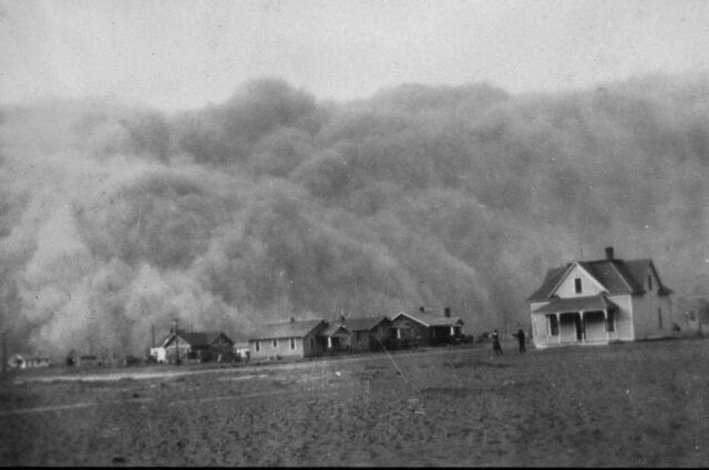 A dust cloud approaches  a town in Texas