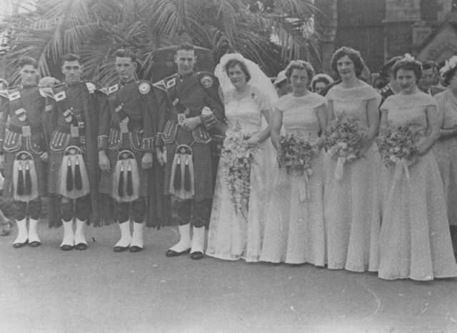 Wedding group outside a church, 1951.