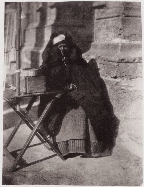Candle seller in front of the cathedral, Chartres, France. Photograph taken by Charles Nègre, 1851.