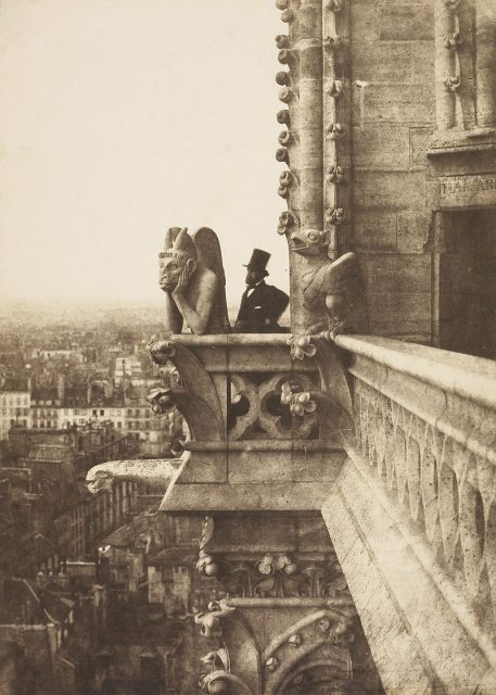 ‘The Vampire’ – Painter/photographer Henri Le Secq poses behind a gargoyle of Notre-Dame de Paris. Photograph taken by Charles Nègre, 1853.
