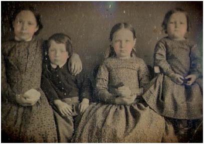 Daguerrotype of four children from the 1850s.