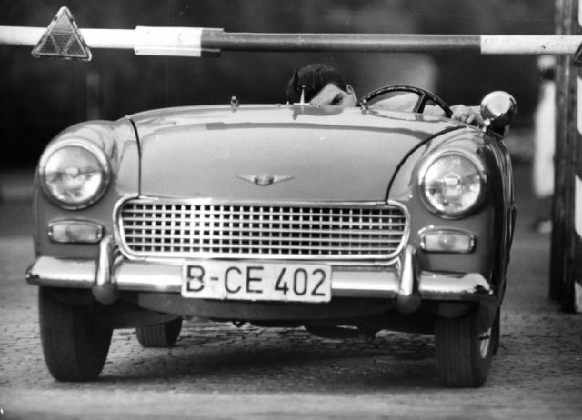 This is how Heinz Meixner drove his Sprite car, with the windscreen cut so that it would be low enough to run under frontier posts in Berlin, Germany, circa 1961. Photo by Express/Archive Photos/Getty Images