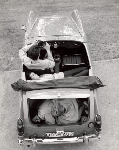 Heinz Meixner with his fiancee and her mother Frau Thurau, showing how they arranged themselves in his Austin-Healey Sprite to drive through the Berlin Wall, Germany, circa 1965. Photo by Express Newspapers/Getty Images