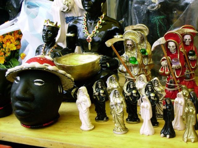 Santa Muerte statuettes at Mercado de Sonora, Mexico City. Photo by Maurice Marcellin CC BY-SA 3.0