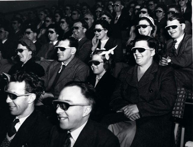 Audience wearing special glasses watch a 3D stereoscopic film at the Telekinema on the South Bank in London during the Festival of Britain, 1951