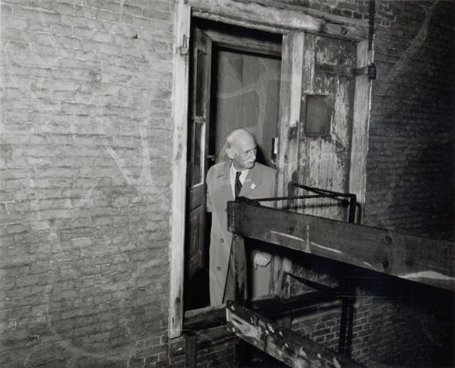 Mr Otto Frank (father of Anne Frank) in the Secret Annex, May 9, 1958. Photo by Ben van Meerendonk / AHF, IISH collection, CC BY 2.0