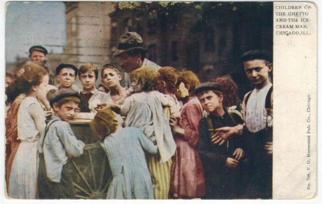 Children in Chicago surround an ice cream vendor in 1909