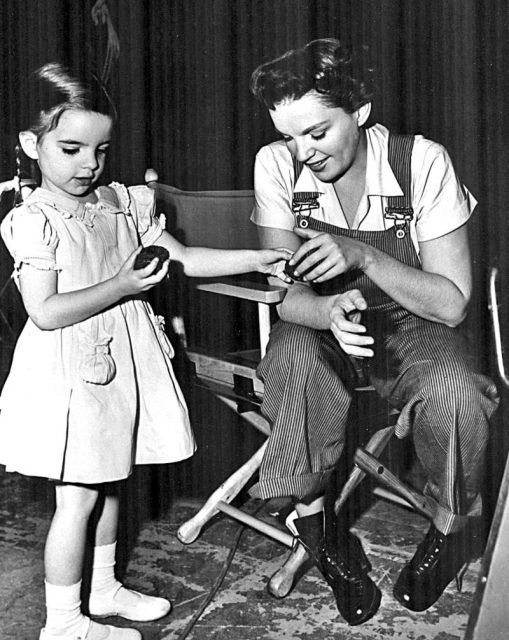 Candid photo of young Liza Minnelli and actress-mother Judy Garland on set of the film ‘Summer Stock’ (1950).