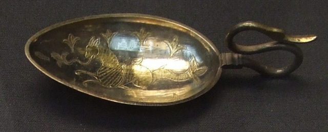A silver-gilt spoon with a marine beast from the Hoxne Hoard. Currently in the British Museum. Photo by JMiall CC BY-SA 3.0