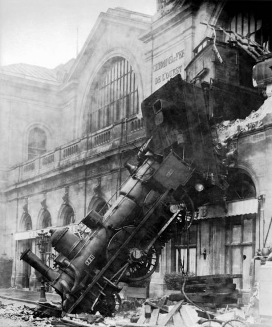 A train lays wrecked after entering Paris’ Montparnasse station too fast and failing to brake before crashing through the station wall and down onto the street below on October 22, 1895.