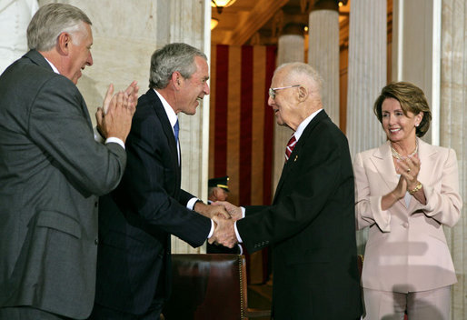 “President George W. Bush along with House Majority Leader Steny Hoyer and House Speaker Nancy Pelosi congratulate Borlaug during the Congressional Gold Medal Ceremony on July 17, 2007”