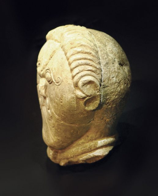 Celtic stone head from ancient Bohemia (150–50 BC), possibly depicting the form of the later Celtic Christian tonsure. Photo by CeStu CC BY 3.0