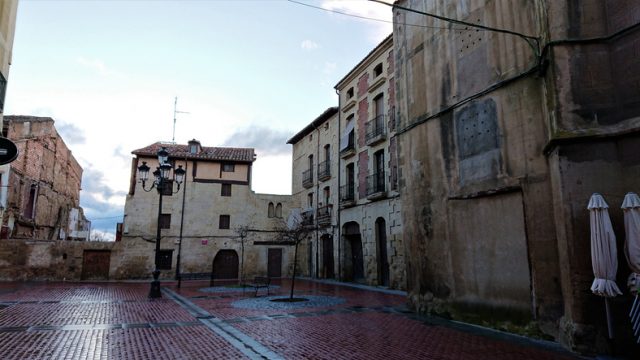 Historic buildings in a medieval village square, Spain