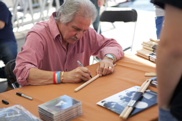 Pete Best autographs a drum stick for a fan at Abbey Road on the River in Washington, D.C., September 2010. Photo by Gary Jacob,CC BY-SA 3.0