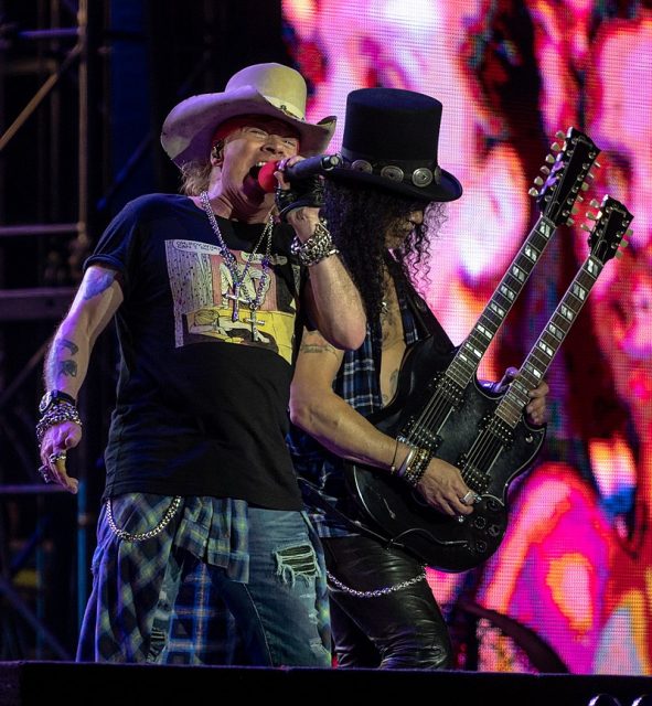 Axl Rose (left) and Slash (right) performing with Guns N’ Roses in 2018. Photo by Raph_PH CC by 2.0