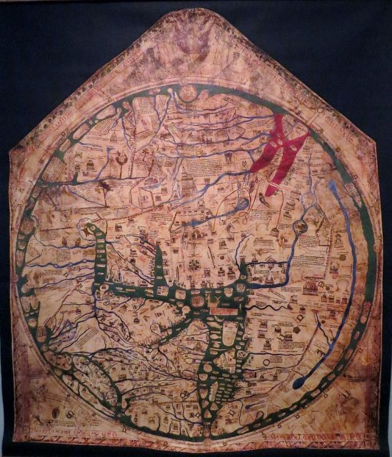 The Hereford map is a mappa mundi, or world map, from the 1300s. It is found above the altar in Hereford cathedral, England. Photo by Bjoertvedt CC BY-SA 3.0