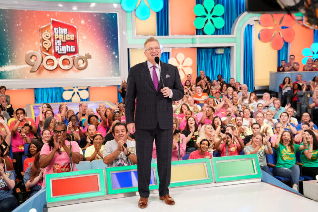 Drew Carey standing with the audience on the set of 'The Price Is Right'