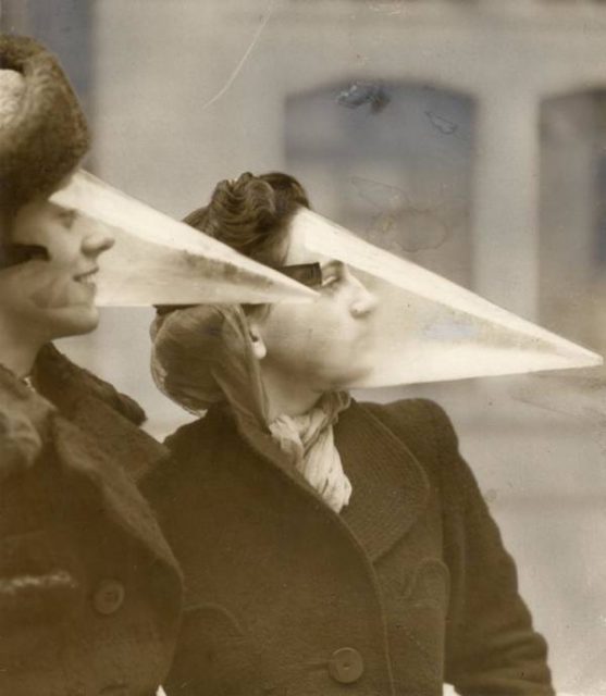 Women wear plastic headgear intended to protect the wearer from snowstorms in Montreal, 1939.