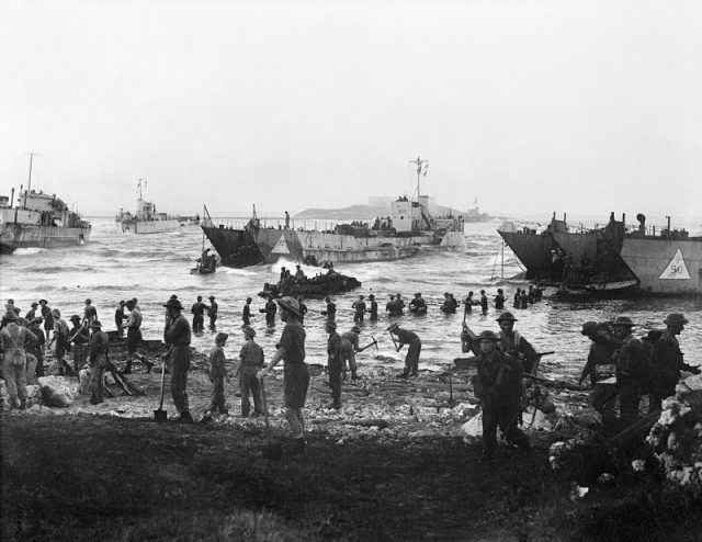 Troops from the 51st (Highland) Division unloading stores from tank landing craft on the opening day of the invasion of Sicily, July 10, 1943