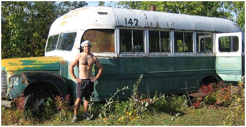 A man named Brett standing at the Fairbanks 142 bus in Alaska. The Into the Wild bus. Photo by Paxson Woelber CC by 2.0