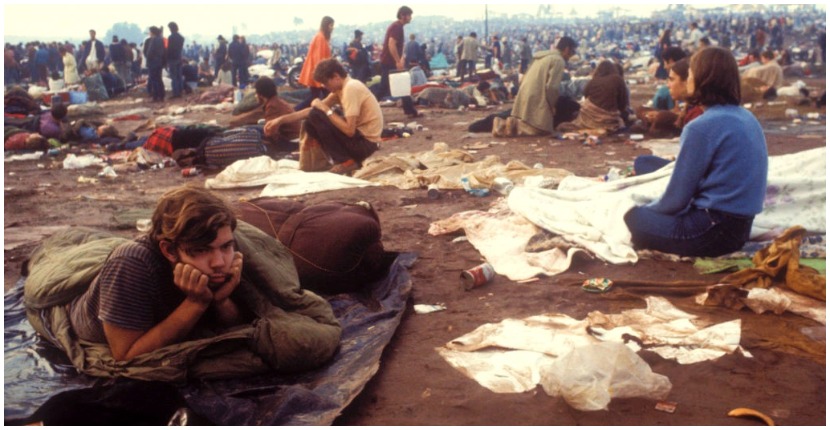 People in the messy field at the Woodstock Music Festival, New York, US, August 1969. (Photo by Owen Franken/Corbis via Getty Images)