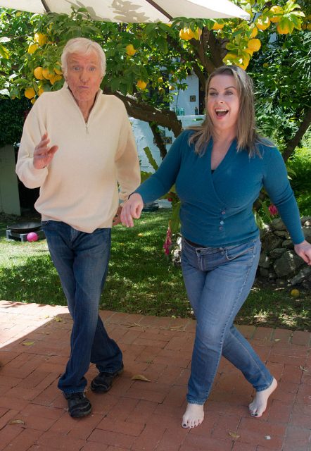 Dick Van Dyke and Arlene Silver holding hands while dancing with each other