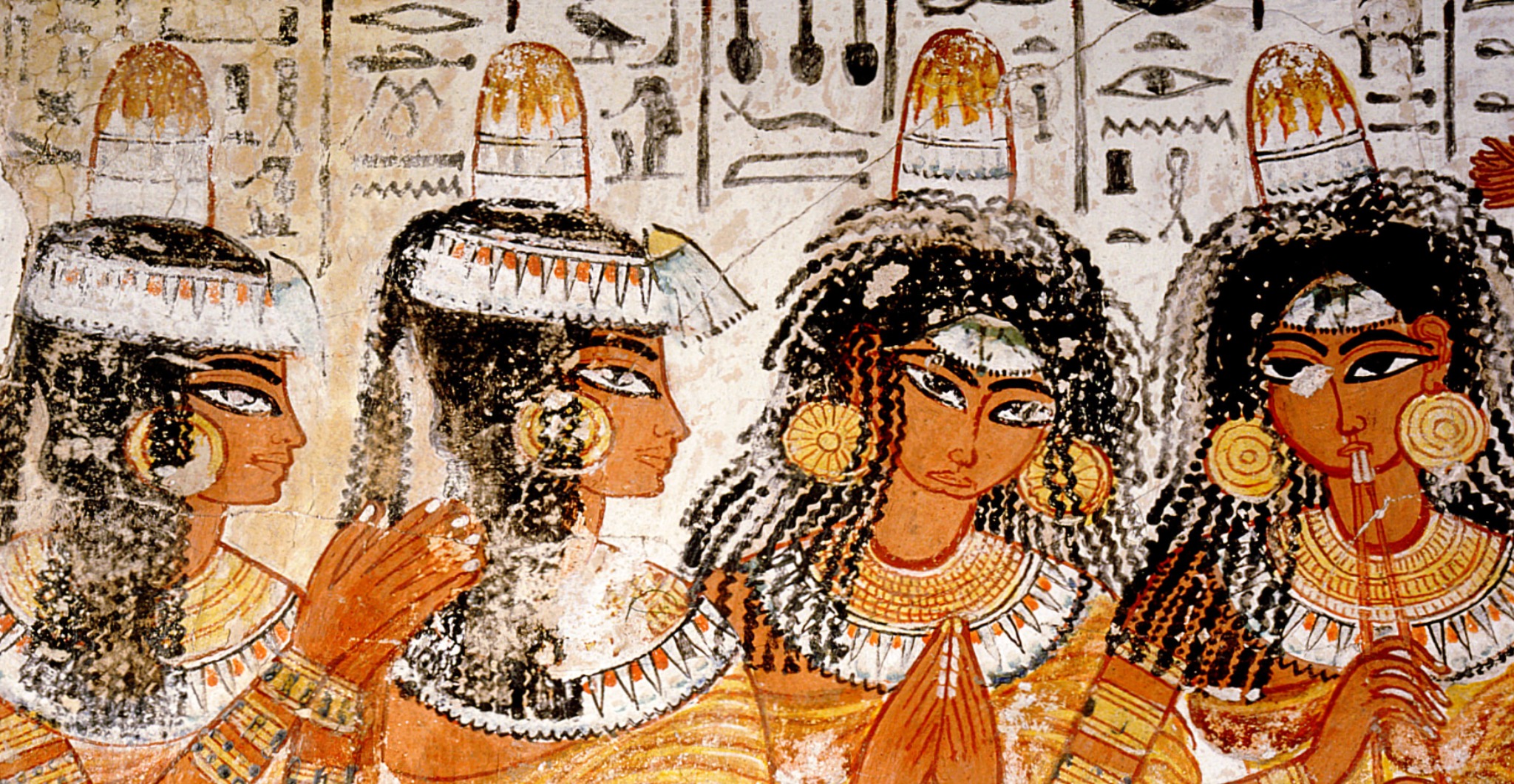 Depiction of women with head cones from Ancient Egypt. Getty Images