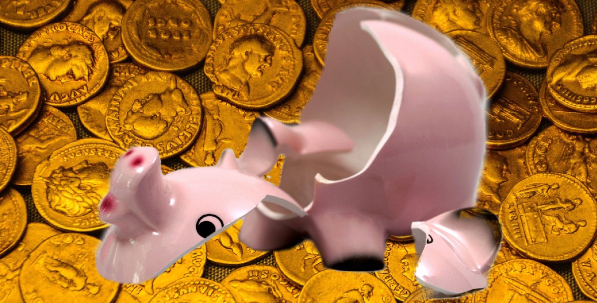 Piggy bank full of gold coins