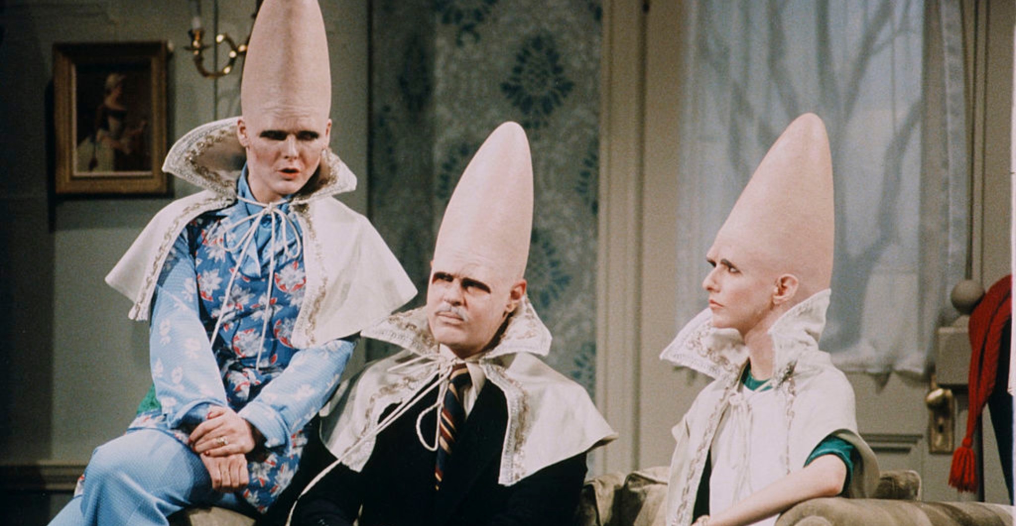 ane Curtin as Prymaat Conehead, Dan Aykroyd as Beldar Conehead, Laraine Newman as Connie Conehead during the 'The Coneheads At Home' skit on January 15, 1977 (Photo by NBCU Photo Bank/NBCUniversal via Getty Images via Getty Images)