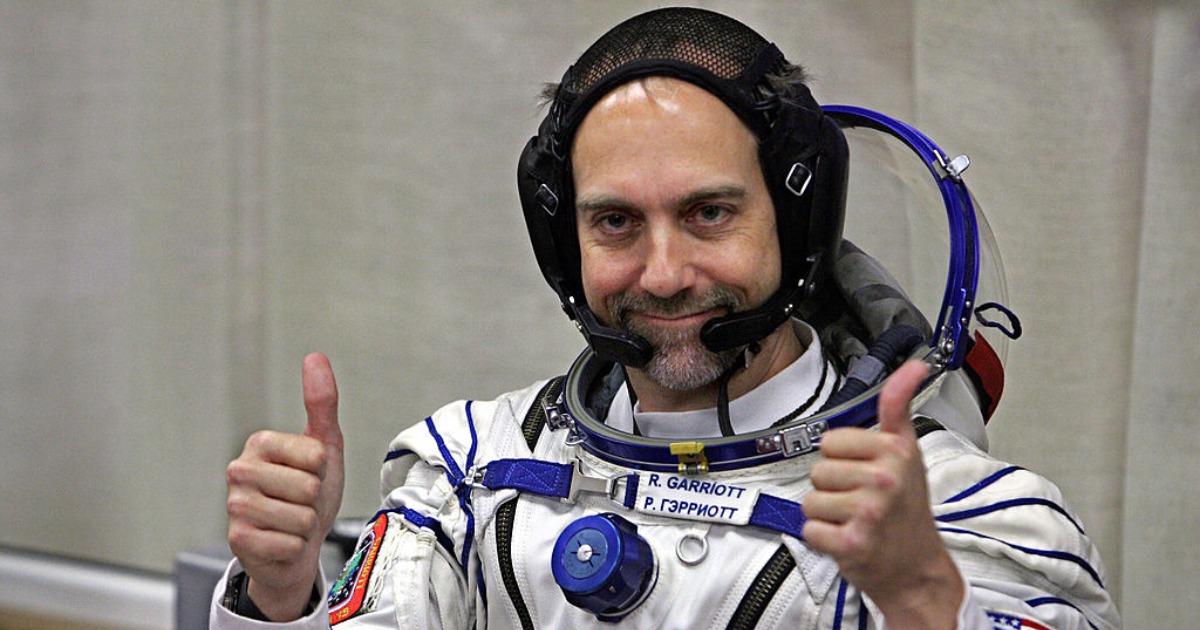 Space tourist Richard Garriott gestures after putting on a space suit at the Baikonur cosmodrome, in Kazakhstan, on October 12, 2008. (Photo credit should read DMITRY KOSTYUKOV/AFP via Getty Images)