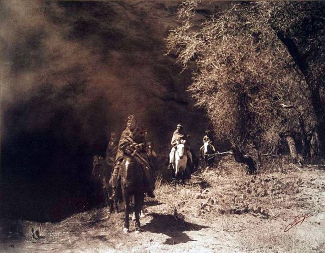 Navajos on horseback in the early 1900s