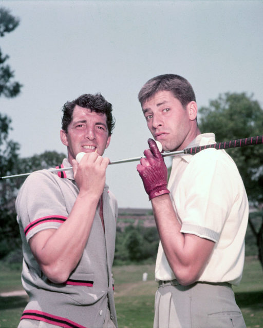 Dean Martin and Jerry Lewis posing with a golf club