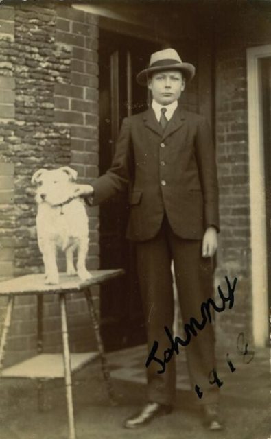 Prince John standing with a dog