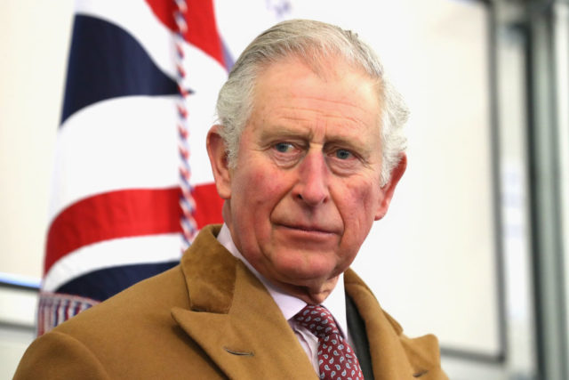 Charles in front of the flag