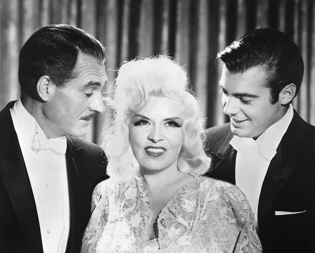 (Original Caption) Mae West with (left) Alan Marshal, her leading man who died Sunday, July 8, and (right), his son, Alan Marshal who also appears in Sextette with Miss West.
