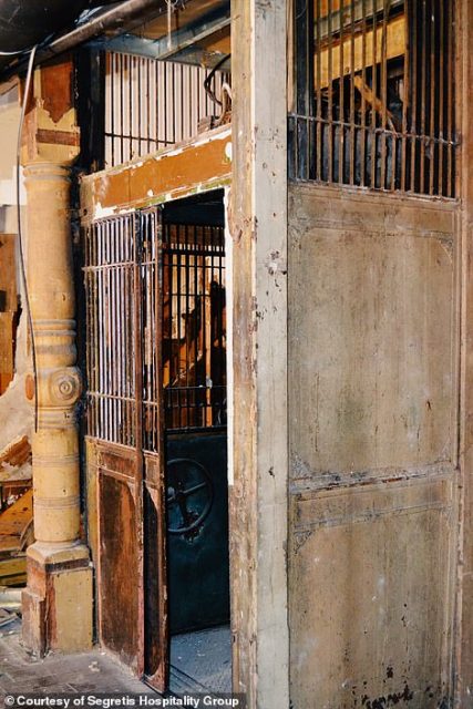an elevator dating back more than 100 years found behind sheetrock next to a carved wooden post. Credit: Segretis Hospitality Group
