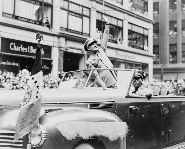 Dwight Eisenhower waves to crowd in 1945