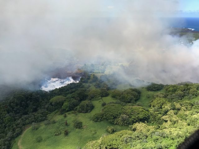 Aerial photograph of lava flows evaporating Green Lake on June 2, 2018