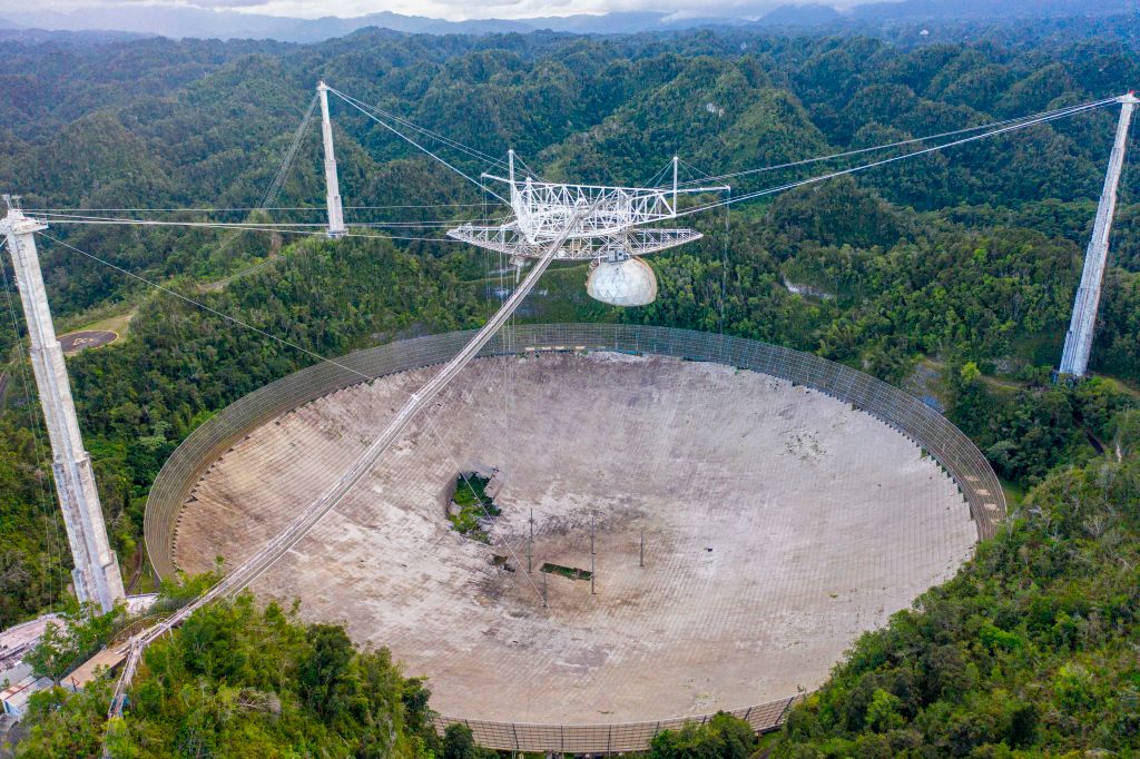 Its 900-tonne instrument platform, suspended by cables 137 metres above a 305-metre-wide reflector dish, fell .Getty Images