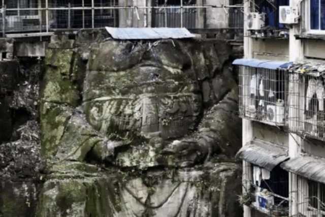 A huge headless Buddha statue is discovered in a residential complex in Chongqing, southwest China. Credit: Daidu