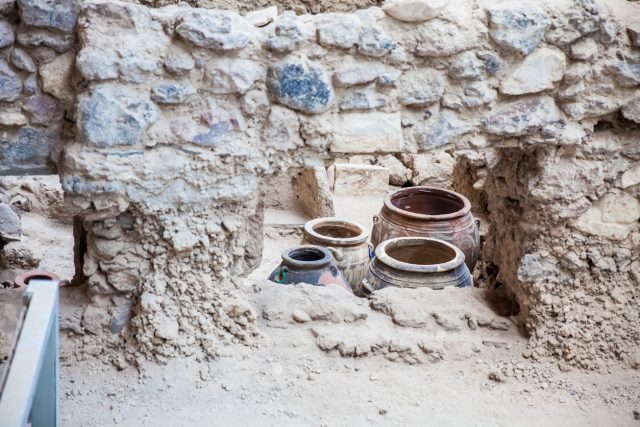 Santorini, Greece – April, 2018: Ancient ruins at Akrotiri archaeological site in the Santorini Island which is believed to have inspired the story told about Atlantis by Plato