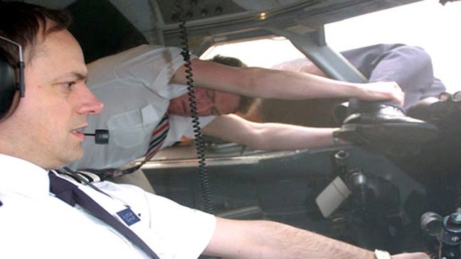 The pilot was then held by his legs within the cockpit (reconstruction). Credit Nat Geo