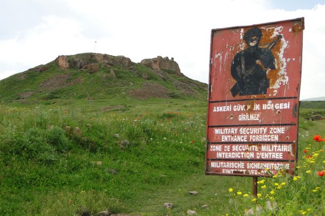 A Military warning sign with the Citadel behind. Adam Jones CC BY 2.0