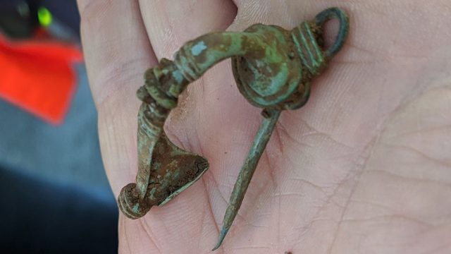 A brooch also discovered at the same settlement has given an insight into daily life as a Roman.. Credit: Highways England