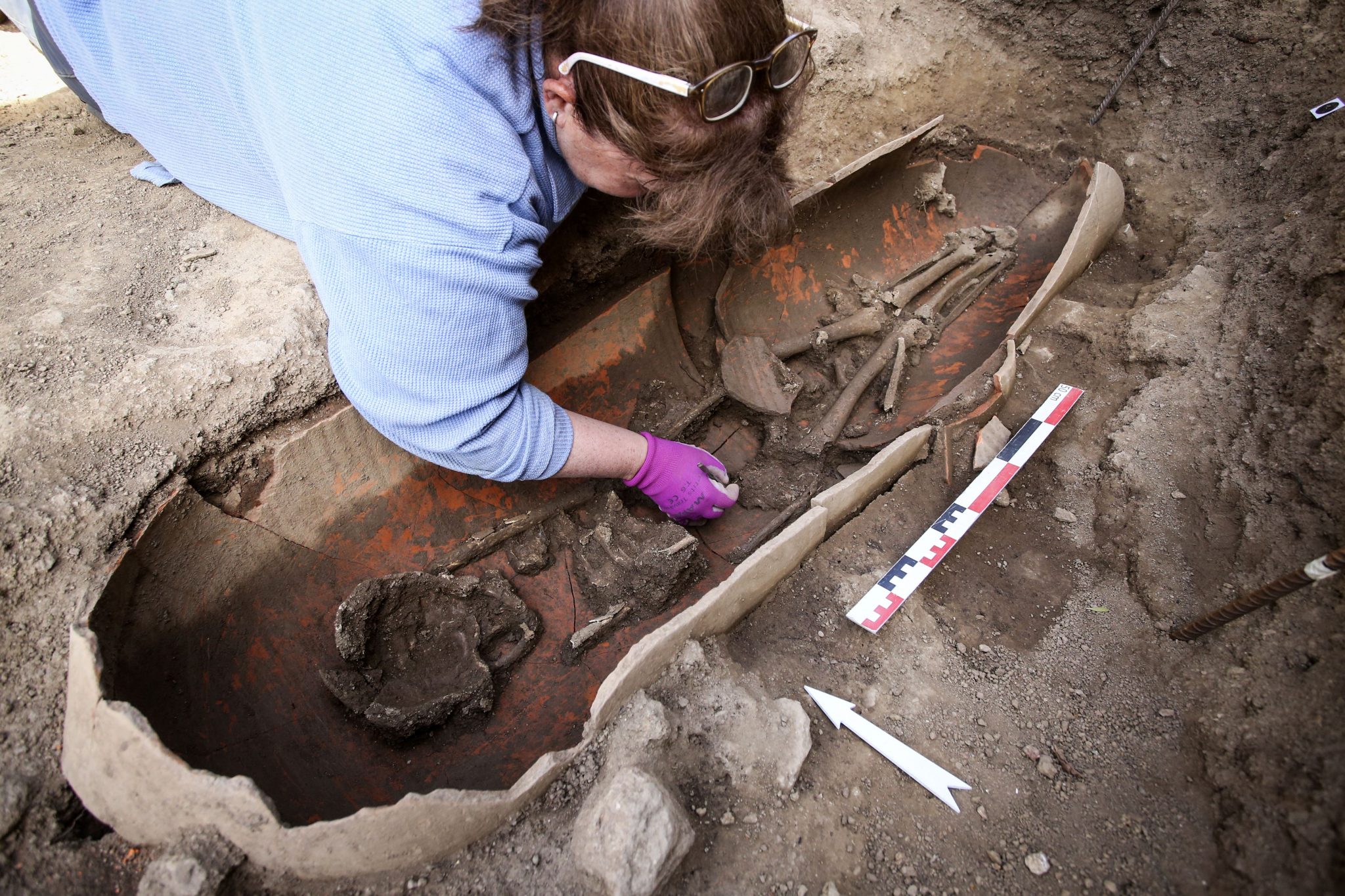 An archaeologist excavating the necropolis discovered in Ile Rousse, in Corsica (Photo Credit: PASCAL POCHARD-CASABIANCA/AFP via Getty Images)
